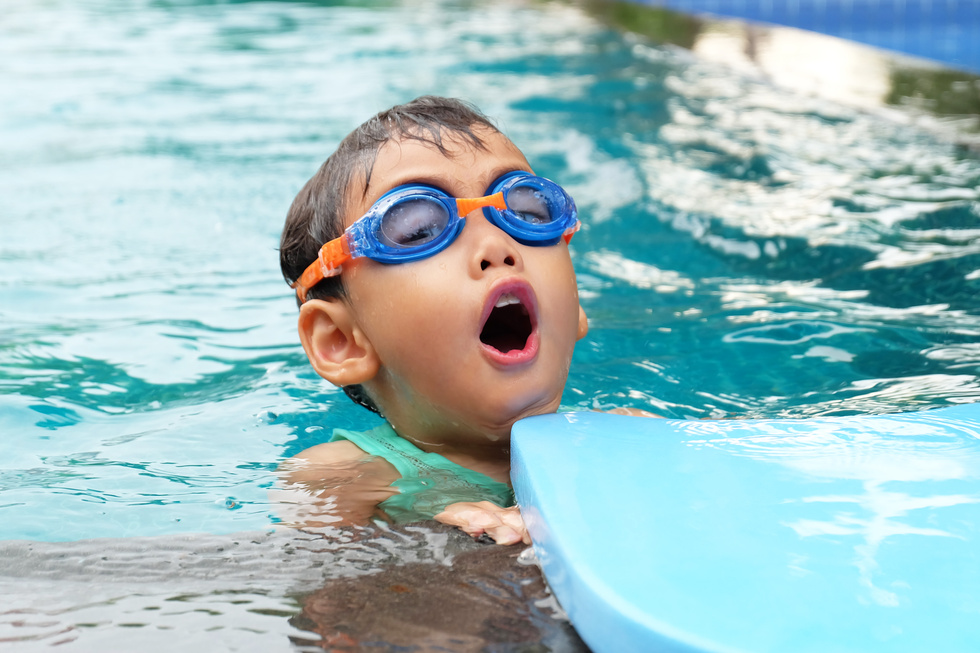 Asian Cute Boy Enjoy Swimming in Pool