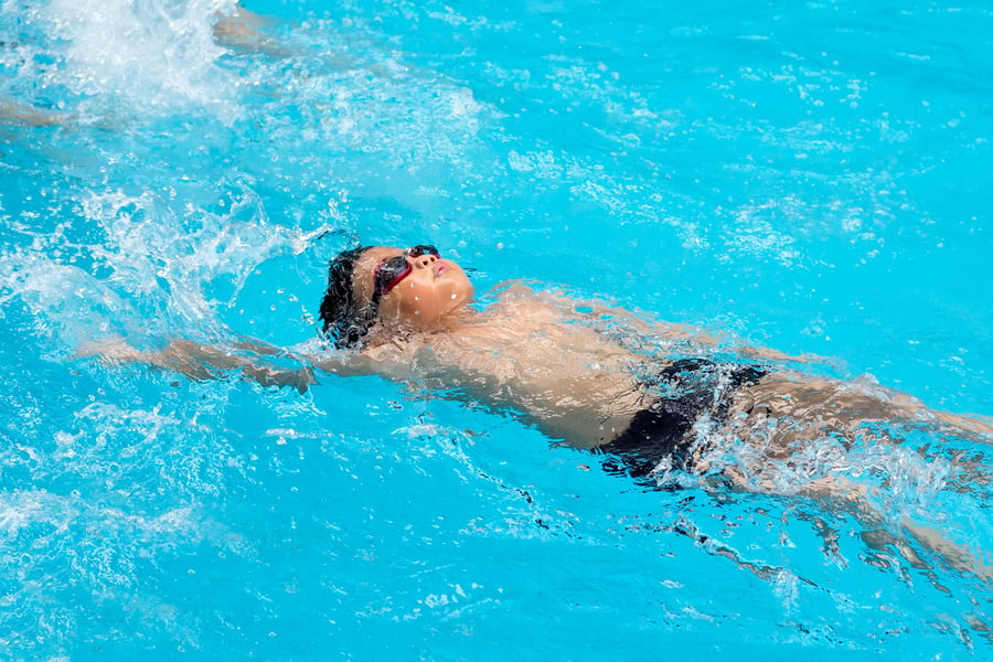 happy kids swim competition in swimming pool